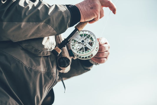 old man holding fishing rod